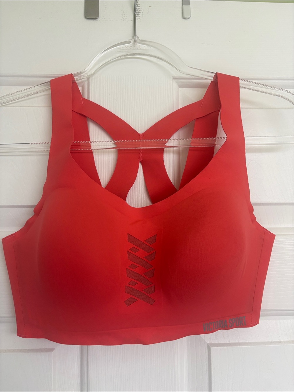 Victoria’s Secret sports bra in coral. High support 36C